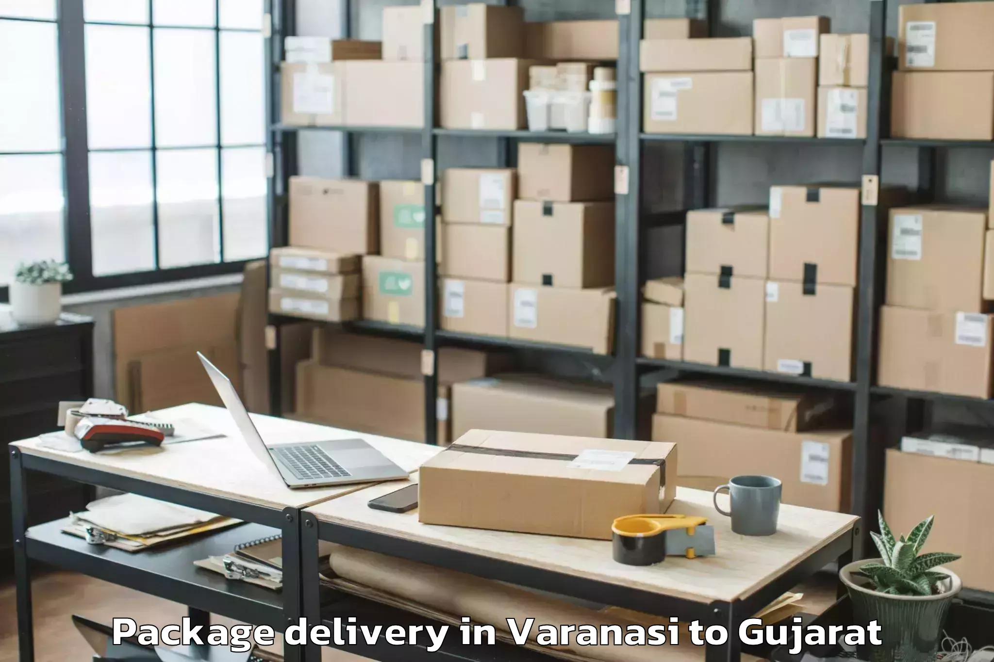 Get Varanasi to Hansot Package Delivery